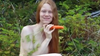 Naked whore fucking her pussy with a carrot