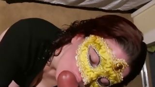 Brunette bitch wearing a mask swallowing a massive cock