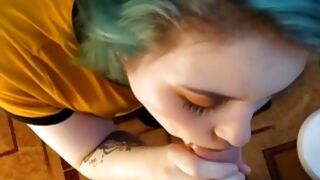 Hot teen with a blue hair blowing a huge tasty cock